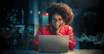 Woman at work using a laptop.
