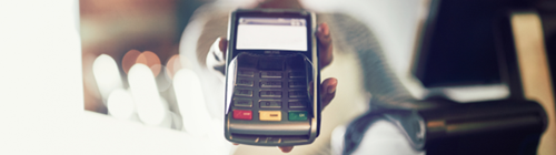 Card reader being held out for payment in a hospitality venue