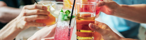 Group of people enjoying a selection of drinks in a bar